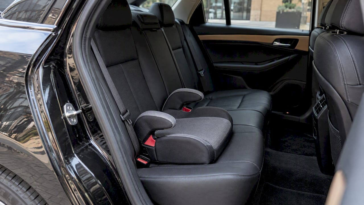 Corporate Chauffeur Service in Toronto: What to Book and Check Booster seat installed in a car’s rear seat
